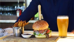 hamburger and fries with beer
