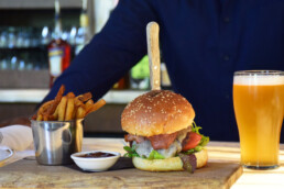 hamburger and fries with beer