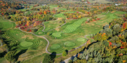 drone shot showcasing the beautiful fall colours golf