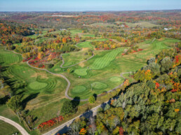 drone shot showcasing the beautiful fall colours golf